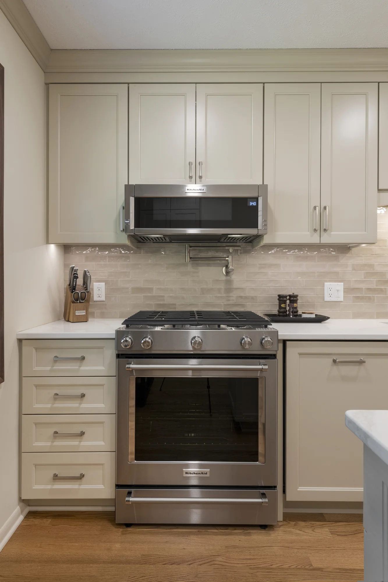 Range wall with full-height neutral cabinetry