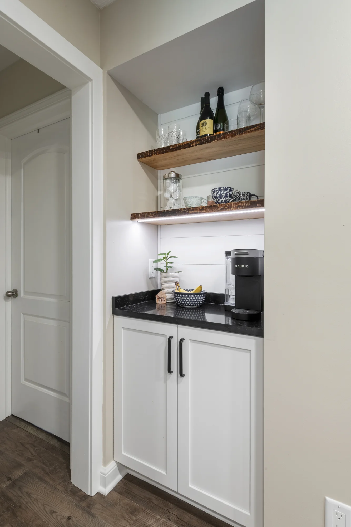 Built-in beverage area with open wood shelves
